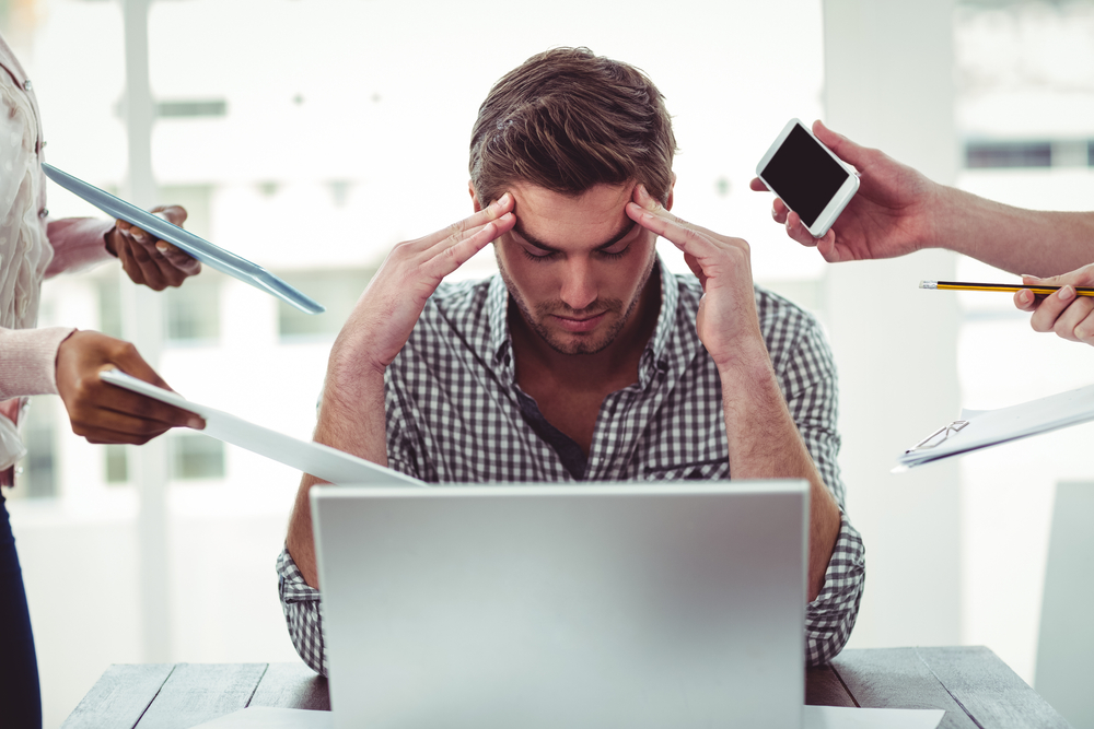 Businessman stressed out at work in casual office Businessman stressed out at work in casual office