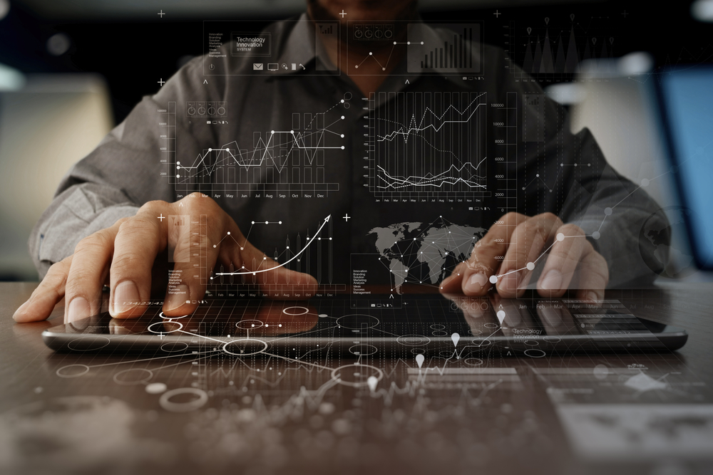 businessman hand working on laptop computer with digital layer business strategy and social media diagram on wooden desk businessman hand working on laptop computer with digital layer business strategy and social media diagram on wooden desk